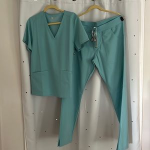 Light bluish/teal Figs Scrubs, size large